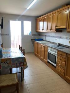 Kuchyň nebo kuchyňský kout v ubytování Casa Rural Rosa Apartamento