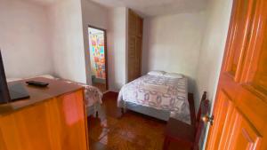 Postel nebo postele na pokoji v ubytování Hotel Posada Don Carlos