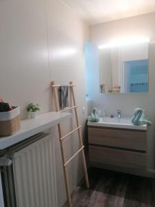 a bathroom with a sink and a mirror at Rent & Relax in Mol