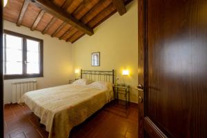 Postel nebo postele na pokoji v ubytování Corte Tommasi Residence