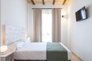 Posteľ alebo postele v izbe v ubytovaní Ad Hoc Vitae Retreats & Health Only Adults