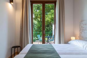 Posteľ alebo postele v izbe v ubytovaní Ad Hoc Vitae Retreats & Health Only Adults