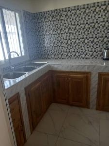 Η κουζίνα ή μικρή κουζίνα στο Villa à SALY Diambars