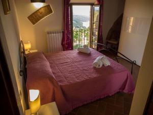 Postel nebo postele na pokoji v ubytování Villa Ginevra-Villa Indipendente-Crete Senesi-Tuscany