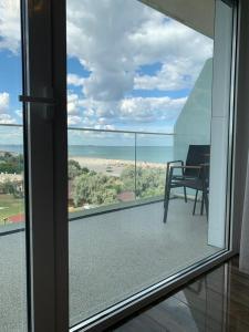 a view of a balcony with a view of the ocean at White Tower Mamaia Prestige Apartments in Mamaia +127 photos