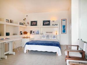 A bed or beds in a room at Villa Marisa - La Guarida