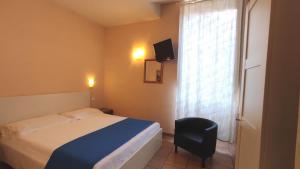 Postel nebo postele na pokoji v ubytování Hotel Rita Major