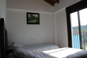 Posteľ alebo postele v izbe v ubytovaní Casa el Genal