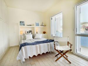 A bed or beds in a room at Villa Marisa - La Guarida