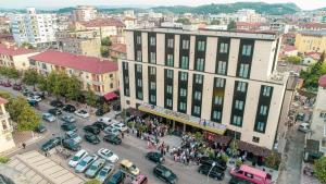 an overhead view of a busy city street with cars at Hotel Golden Palace in Shkodër