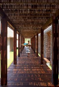 
a room with wooden floors and wooden walls at Hotel Escondido - Adults Only in Puerto Escondido
