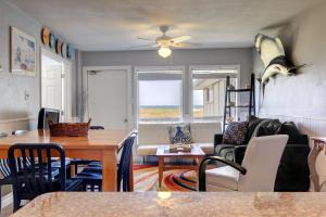 a living room with a table and a couch at Jans Oasis 306BH in Port Aransas