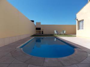 a swimming pool in the backyard of a house at Casitas Virginia in San Rafael