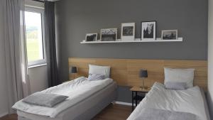 Кровать или кровати в номере Nowa Kamienica 11