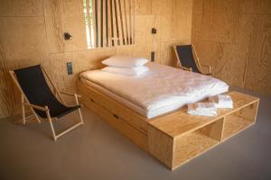 Cama ou camas em um quarto em Wakepond atostogų slėnis