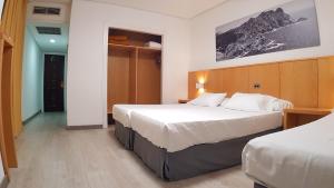 Katil atau katil-katil dalam bilik di Hotel del Mar Vigo
