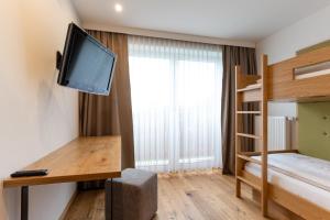 Łóżko lub łóżka w pokoju w obiekcie Hotel Streklhof