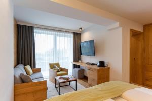 Telewizja i/lub zestaw kina domowego w obiekcie Hotel Streklhof