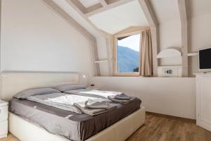 מיטה או מיטות בחדר ב-Appartamento Villa Principessa
