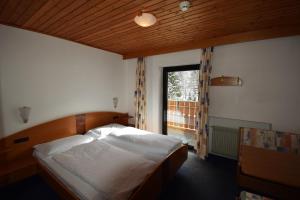 Postel nebo postele na pokoji v ubytování Hotel Montana