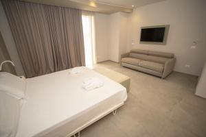 Posteľ alebo postele v izbe v ubytovaní Hotel Malavoglia