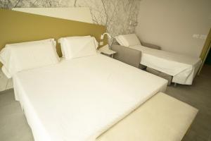 Posteľ alebo postele v izbe v ubytovaní Hotel Malavoglia