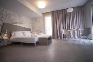 Posteľ alebo postele v izbe v ubytovaní Hotel Malavoglia