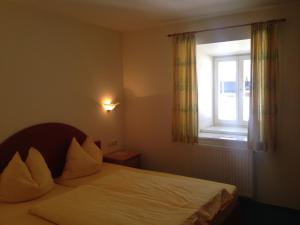 Postel nebo postele na pokoji v ubytování Appartements im Forsthaus