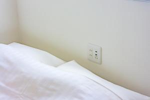 Postel nebo postele na pokoji v ubytování plat hostel keikyu sapporo sky