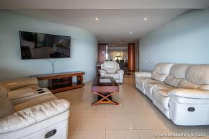 A seating area at Lazy Lizard 41 - with Inverter