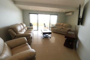 A seating area at Lazy Lizard 41 - with Inverter