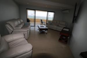 A seating area at Lazy Lizard 41 - with Inverter