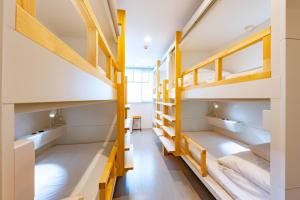 Postel nebo postele na pokoji v ubytování plat hostel keikyu sapporo sky