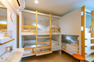 Postel nebo postele na pokoji v ubytování plat hostel keikyu sapporo sky + 37 fotografií