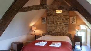 La Vieille Foulonnière : Chambres d'hôtes & Permaculture客房内的一张或多张床位