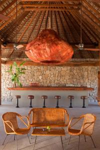 
a large roast beef sitting on top of a wooden table at Hotel Escondido - Adults Only in Puerto Escondido
