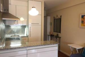 Kuchyň nebo kuchyňský kout v ubytování Apartamento Monte Lourido + 1 fotografie