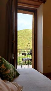 Postel nebo postele na pokoji v ubytování La Casa sul Blu Albergo Diffuso
