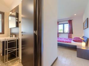 Postel nebo postele na pokoji v ubytování Holiday Home Andrea by Interhome