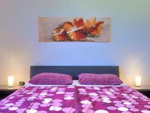 Postel nebo postele na pokoji v ubytování Holiday Home Andrea by Interhome