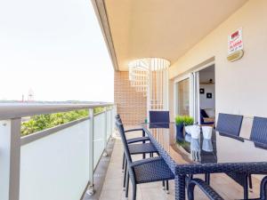 a balcony with a table and chairs on it at Apartment Nou Salou in Salou