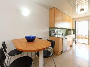 a kitchen with a table and chairs in a room at Apartment Nou Salou-1 by Interhome in Salou