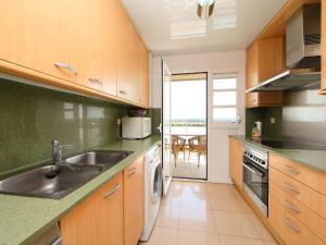 a kitchen with a sink and a dishwasher at Apartment Nou Salou-1 by Interhome in Salou