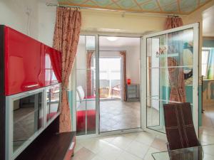 a living room with sliding glass doors and a living room at Apartment Ivana-2 by Interhome in Raslina