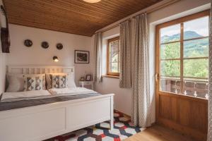 Postel nebo postele na pokoji v ubytování Ferienwohnungen Villa Salzweg + 37 fotografií