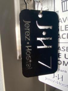 a key chain with the word foreclosure on it at Jerez Hostel in Jerez de los Caballeros
