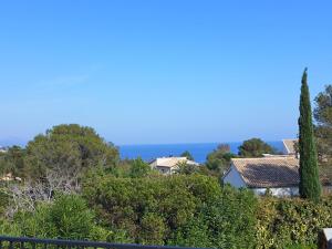 a view of the ocean from a house at Villa La Maison du Midi by Interhome in Saint-Aygulf