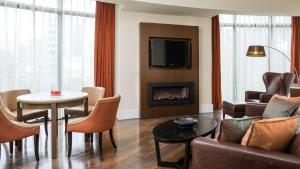 
a living room filled with furniture and a fire place at Radisson Blu Hotel, Addis Ababa in Addis Ababa
