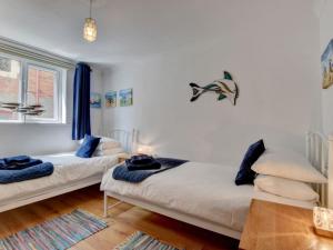 Un pat sau paturi într-o cameră la Apartment Beachcomber by Interhome