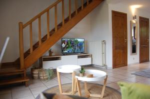 TV a/nebo společenská místnost v ubytování Appartement Fleurs des champs - Esc'Appart